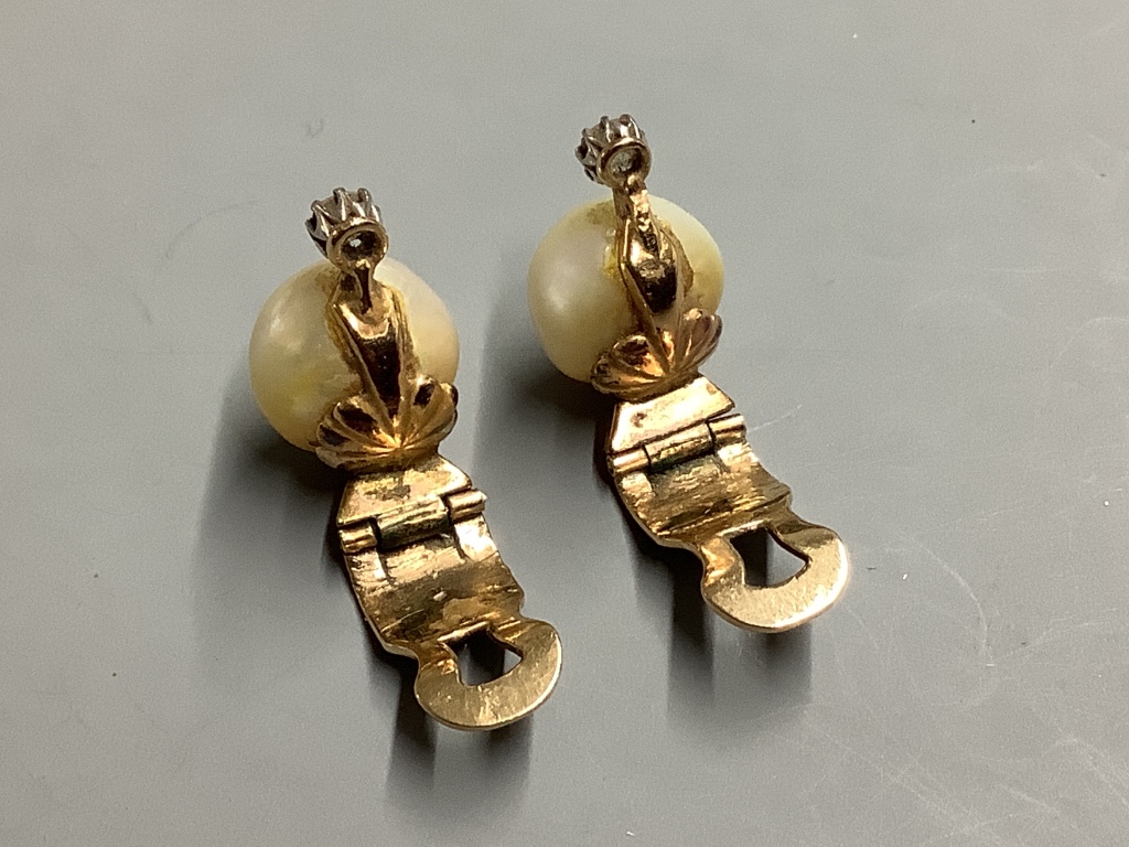 A pair of yellow metal, baroque pearl and diamond set ear clips